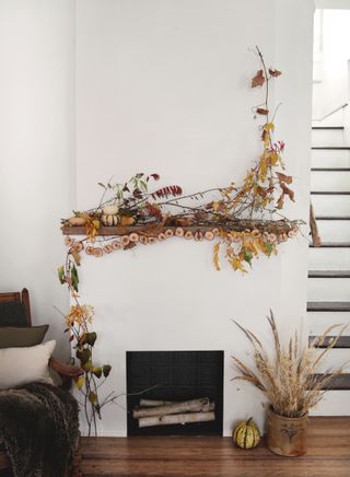 A mantel designed minimally, with foraged elements