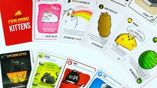 best board games for two players - a set of Exploding Kittens cards, featuring cars such as the "rainbow-ralphing cat"