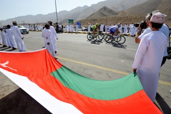 Oman citizens watch the racers pass