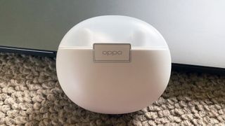 the oppo enco air true wireless earbuds in their charging case