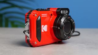 A red Kodak PIXPRO WPZ2 compact camera