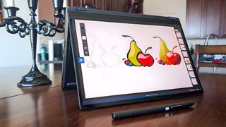 ASUS ProArt PX13 drawing in tent mode.