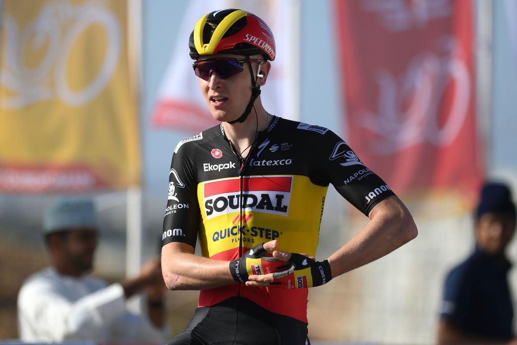 Tim Merlier rocks the baby after winning stage 1 of Tour of Oman