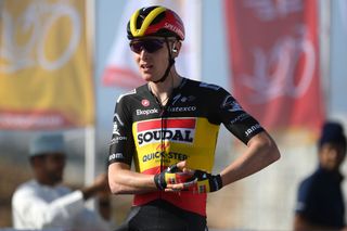 Tim Merlier rocks the baby after winning stage 1 of Tour of Oman