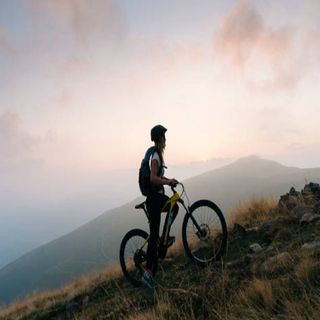Cyclist riding in the mountains
