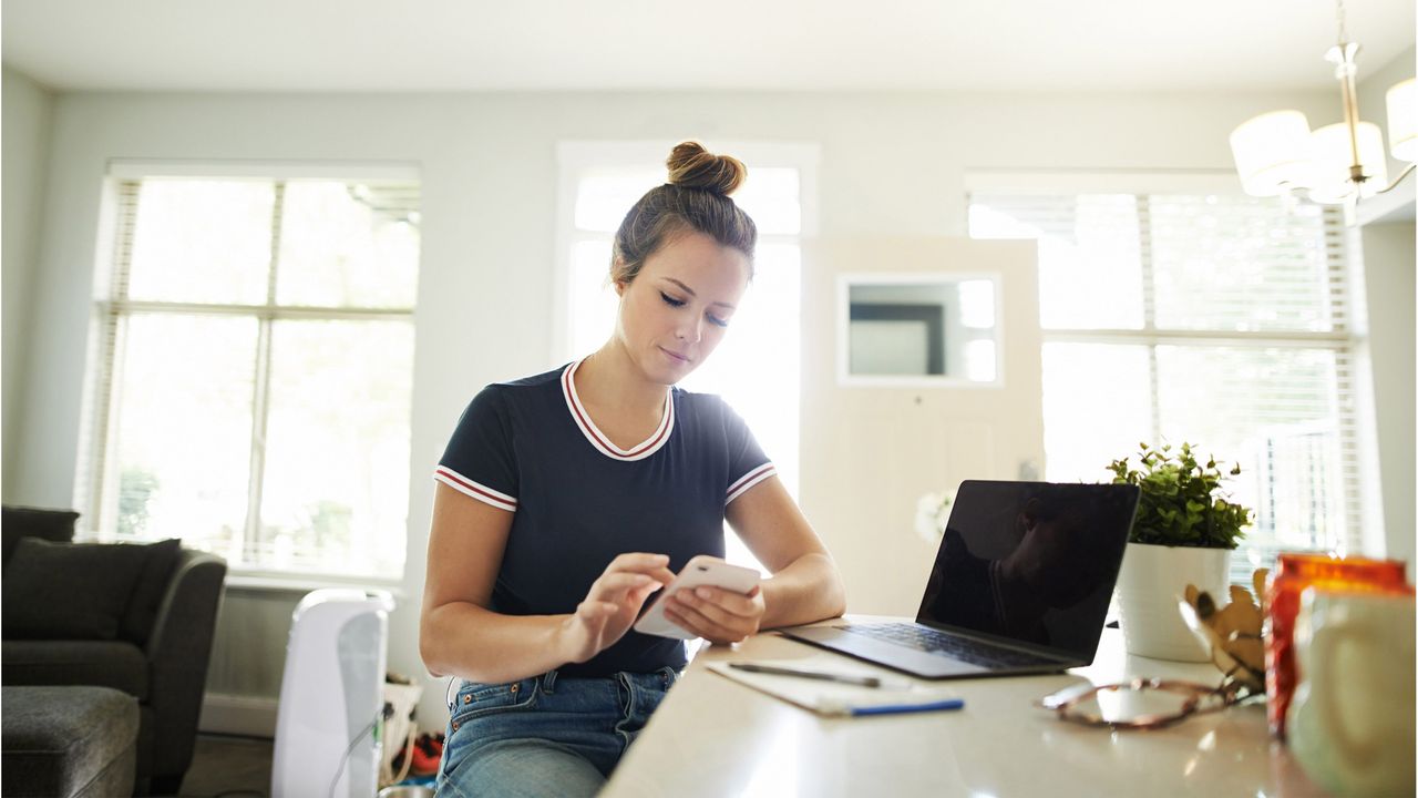 photo illustration of woman looking at phone