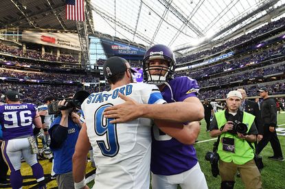 Lions quarterback Matt Stafford (left) and Vikings quarterback Sam Bradford embrace after the Lions' victory Nov. 6.