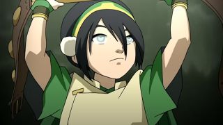Toph holding a champion belt above her head in Avatar: The Last Airbender.