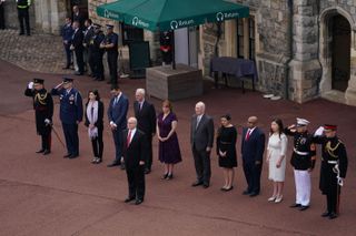Delegates from the United States Embassy, including acting US Ambassador, Philip T Reeker, Charge d'Affaires, observe a minute's silence during the changing of the Guard at Windsor Castle to mark the 20th anniversary of the 9/11 terror attacks in the US, on September 11, 2021.