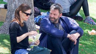 Jennifer Garner and Ben Affleck sitting in a park in 2018