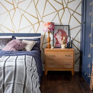 Blue bedroom with patterned table lamp