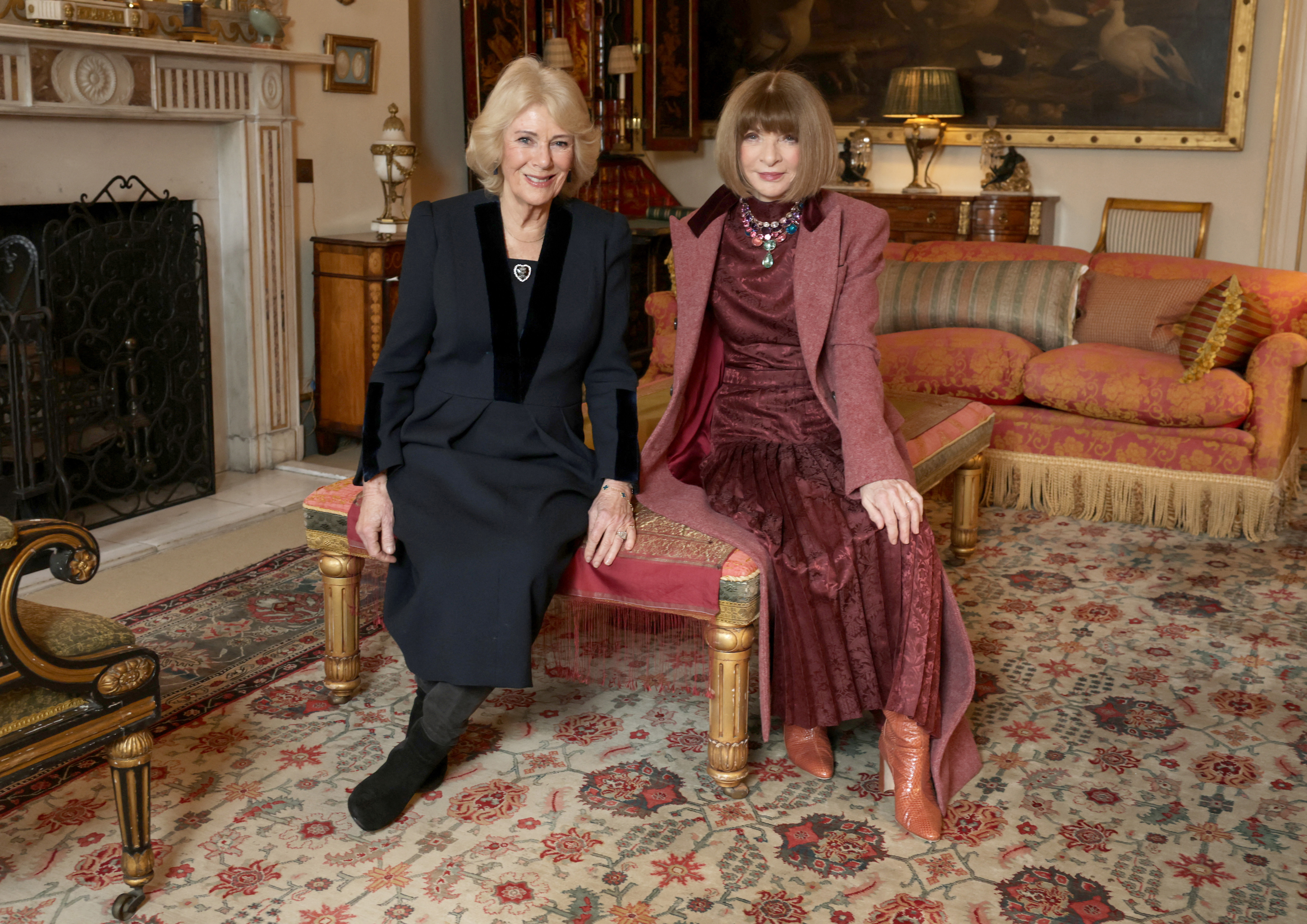 Britain's Queen Camilla (L) poses with former editor-in-chief of Vogue Anna Wintour (R) during an audience on February 19, 2026 in London. (Photo by Chris Jackson / POOL / AFP)