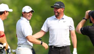 Rory McIlroy and Michael Block celebrate a hole in one