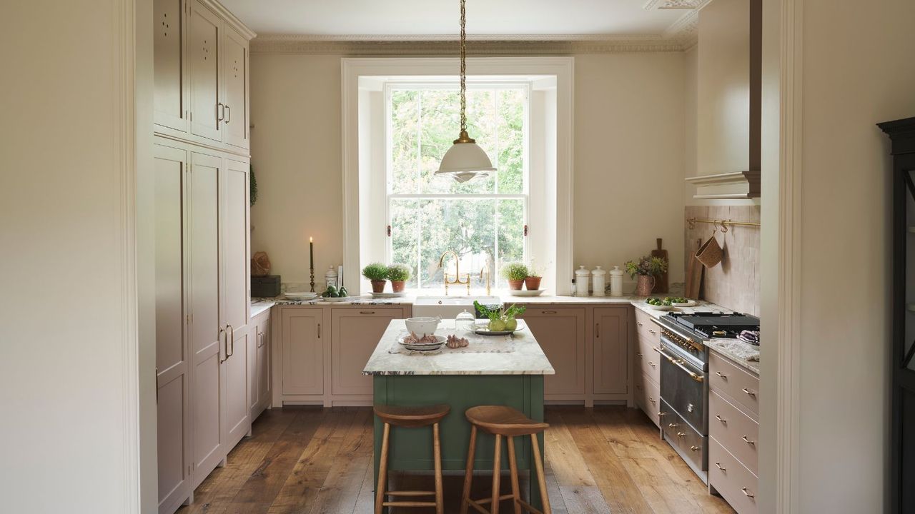 A pink and green Victorian kitchen by deVOL