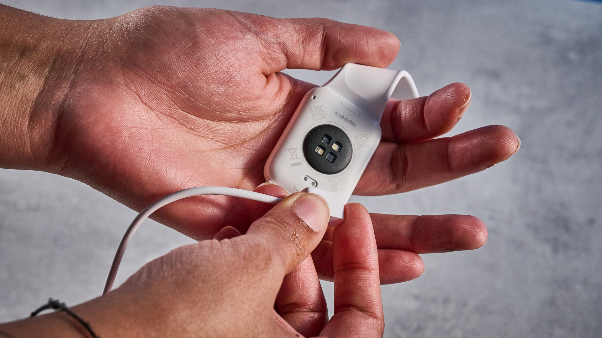 A person wearing a Xiaomi Smart Band 10 Pro