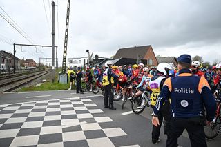 Riders who ran level crossing red light during men's Tour of Flanders could face fines and short driving bans, says Flemish prosecutor
