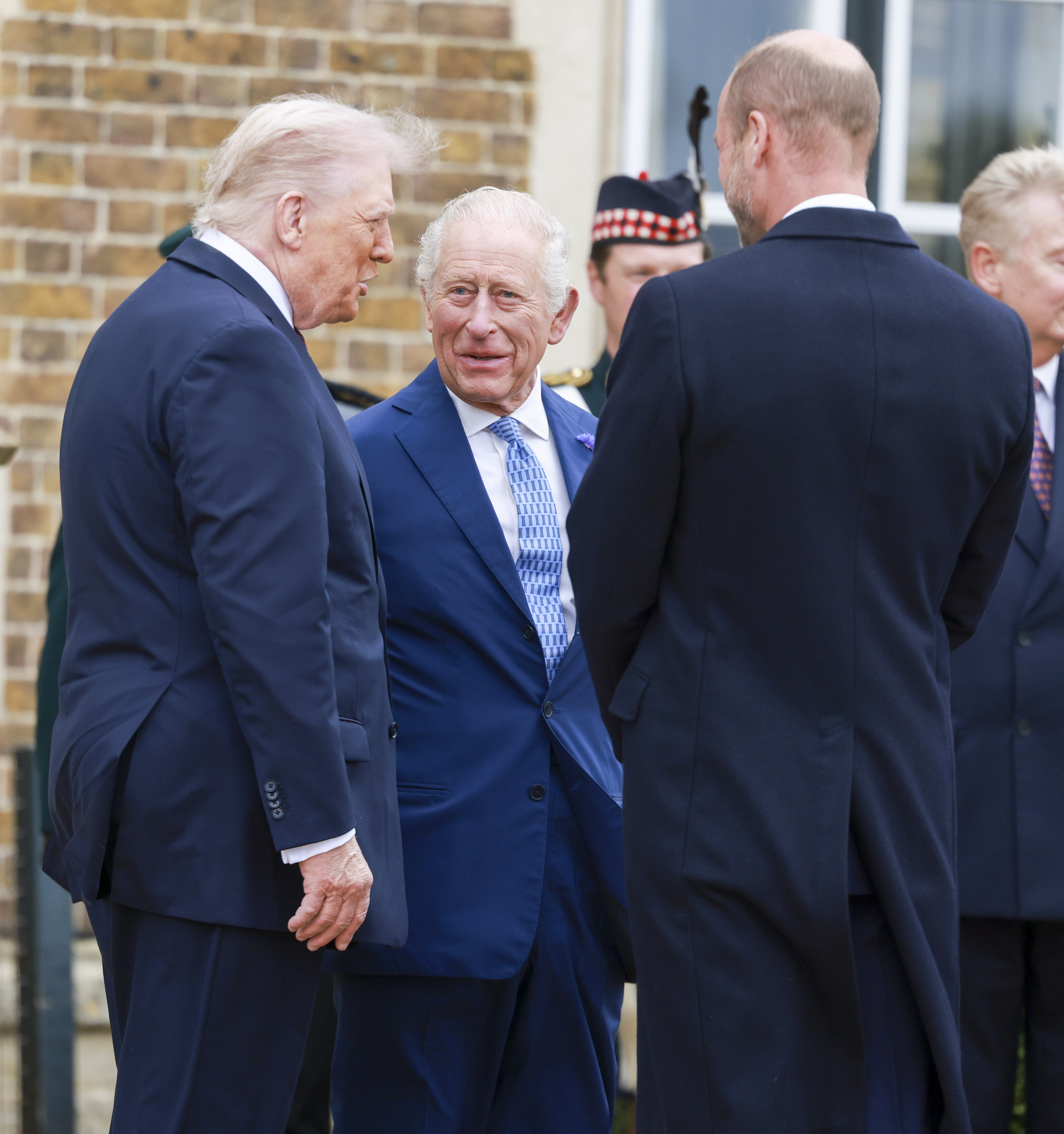 President Trump talking to King Charles and Prince William