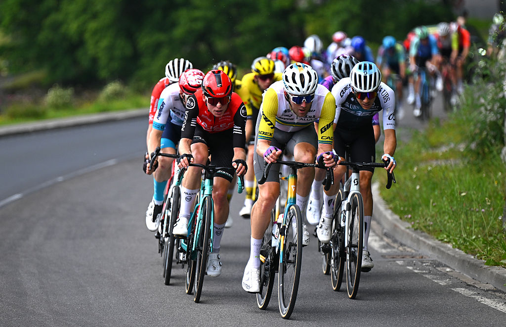 KUSNACHT, SWITZERLAND - JUNE 15: (L-R) Mathis Le Berre of France and Team Arkea - B&B Hotels, Luke Durbridge of Australia and Team Jayco AlUla and Matteo Badilatti of Switzerland and Team Q36.5 Pro Cycling compete in the breakaway during the 88th Tour de Suisse, Stage 1 a 129.4km at stage from Kusnacht to Kusnacht / #UCIWT / on June 15, 2025 in Kusnacht, Switzerland. (Photo by Tim de Waele/Getty Images)