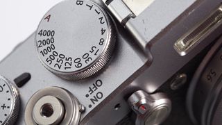 Close-up product image of Fujifilm X100T dials on a white background