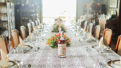 Filipino rum by Don Papa on table with white lace tablecloth 