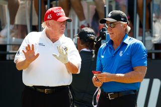 Trump and Greg Norman chat during a LIV Golf event
