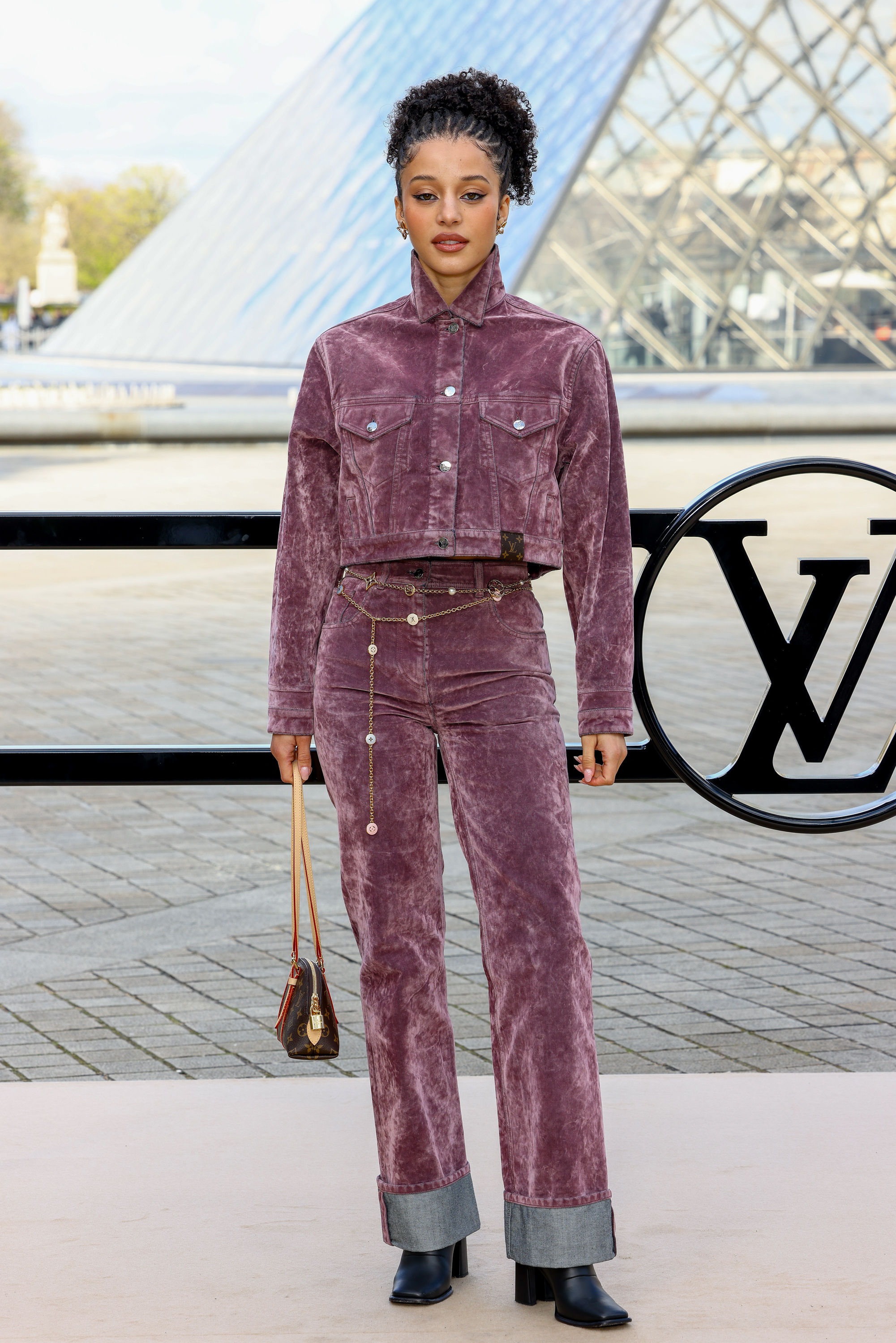 Chase Infiniti attended the Louis Vuitton Fall 2026 fashion show with a monogram bag