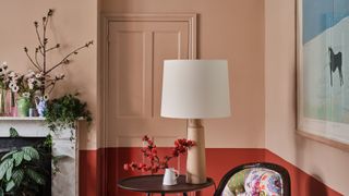 Living room with pink and red two tone walls showing farrow & Ball's 2023 paint color trends