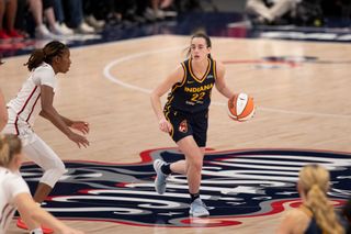 Indiana Fever guard Caitlin Clark (22) looks for teammates cutting to the basket during the WNBA game between the Indiana Fever and the Washington Mystics on September 19th, 2024