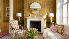 traditional living room with ochre wallpapered walls