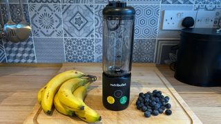 Nutribullet Flex blender with fruit on kitchen counter