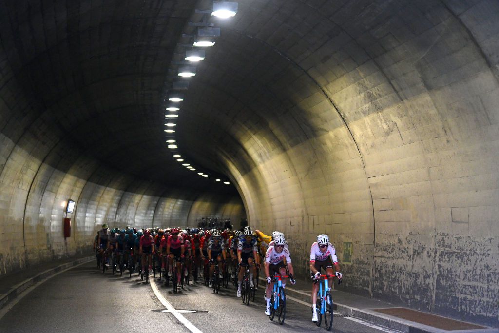 LA PUNT SWITZERLAND JUNE 15 Michael Schr of Switzerland Felix Gall of Austria and Ag2R Citron Team Yellow Leader Jersey with teammates lead the peloton passing through a tunnel during the 86th Tour de Suisse 2023 Stage 5 a 211km stage from Fiesch to La Punt 1696m UCIWT on June 15 2023 in La Punt Switzerland Photo by Dario BelingheriGetty Images