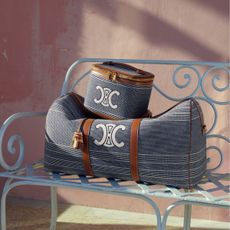 two celine bags on a bench