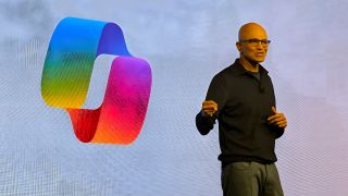 Satya Nadella on stage at an event in London talking about Copilot