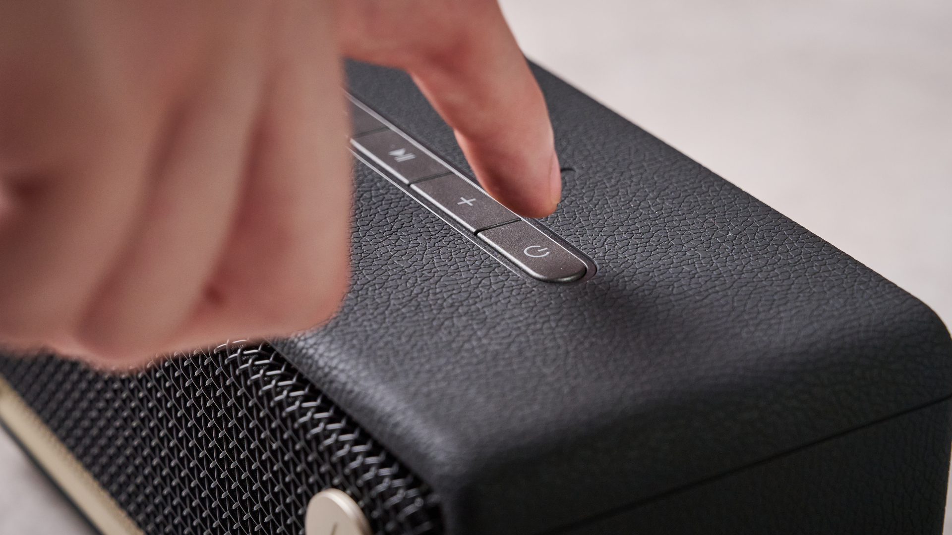 Man pressing button on the Edifier ES60