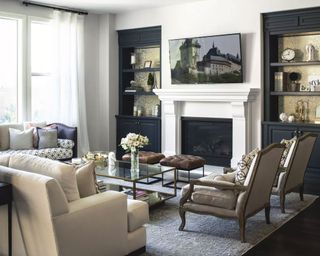 Black, white and gray living room, fireplace, black alcove shelving, seating, gray rug