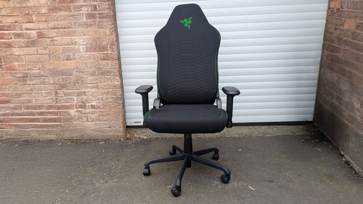 Razer Iskur V2 X gaming chair set-up outside with some Razer branded gloves!