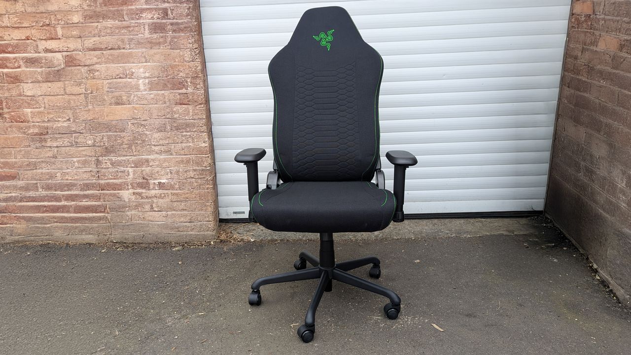 Razer Iskur V2 X gaming chair set-up outside with some Razer branded gloves!