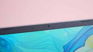 Close-up of webcam on Acer Aspire Go 15, with pink wall in background