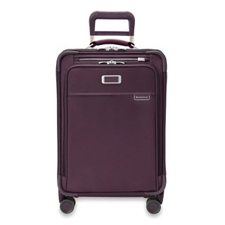 The 22" Briggs & Riley Baseline Essential Carry-On in a burgundy red