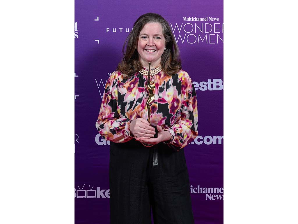 Kate O&rsquo;Brian, president, Scripps News, with her Wonder Women trophy.