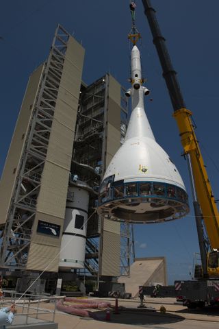 A test version of NASA's Orion crew module for Ascent Abort-2, with its launch abort system attached, is hoisted by crane at Space Launch Complex 46 at Cape Canaveral Air Force Station in Florida on May 23, 2019.