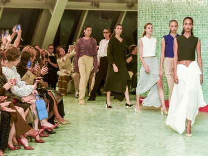 Runway models walk in the finale during the Tory Burch spring/summer 2025 show.