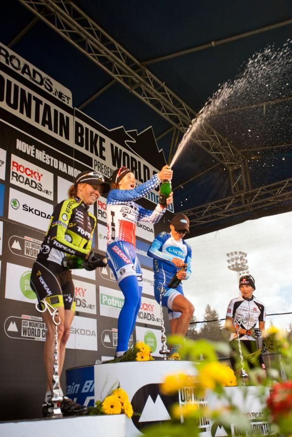 Julie Bresset (BH - SR Suntour - Peisey Vallandry) opens the winner's champagne on the podium