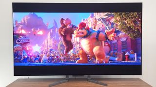LG OLED evo M3 TV shown in living room with Super Mario Bros movie on screen