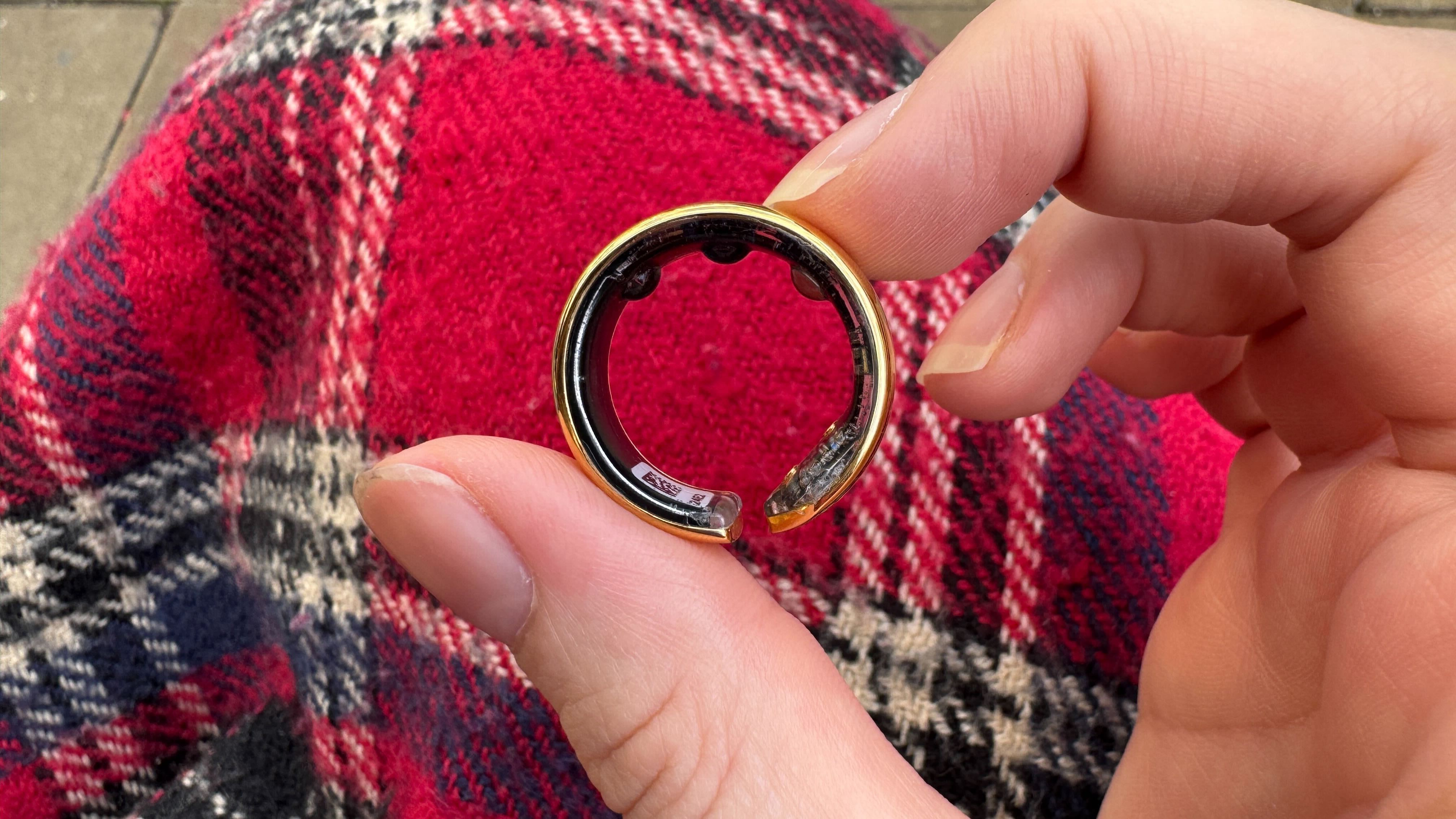 Evie Smart Ring being held