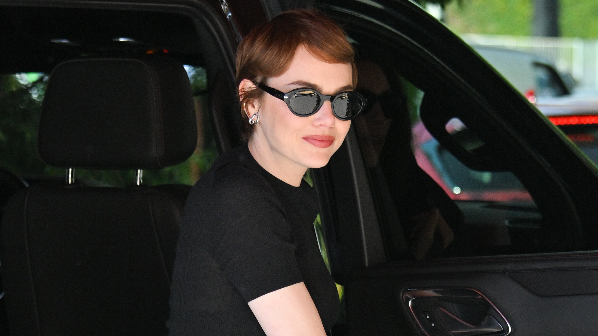 Emma Stone arrived at the Venice Film Festival in the toe-ring sandal trend and two Louis Vuitton bags