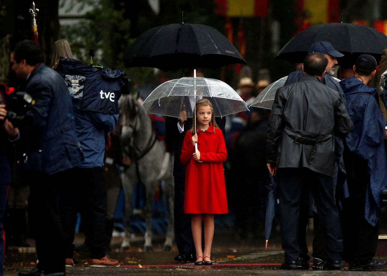 Spanish Princess Sofia holds an umbrella at the start of a military parade marking Spain&amp;#039;s National Day in Madrid, Spain. 