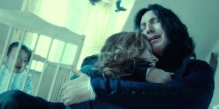 Severus Snape holds his beloved, slain Lily Potter in front of an infant Harry Potter