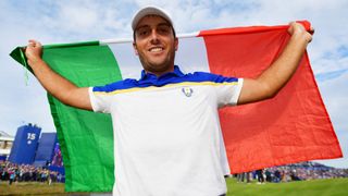 Francesco Molinari holding up an Italian flag
