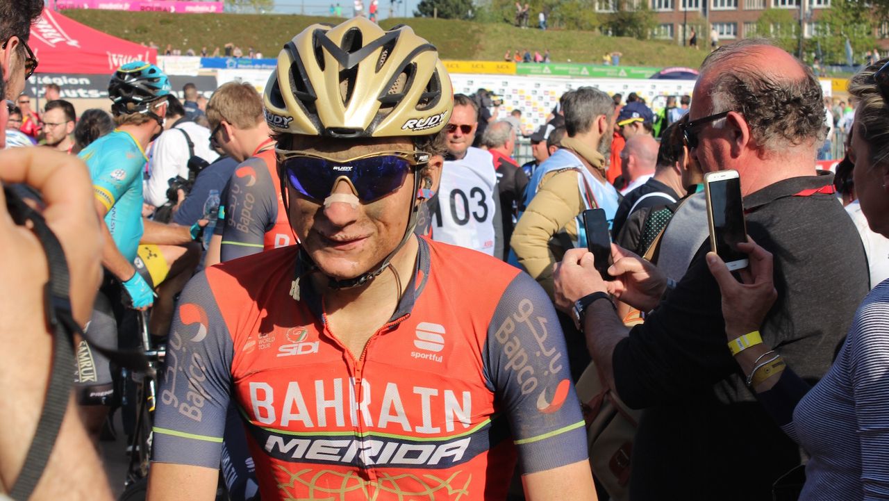 Niccolo Bonifazio works his way through the melee of journalists and fans